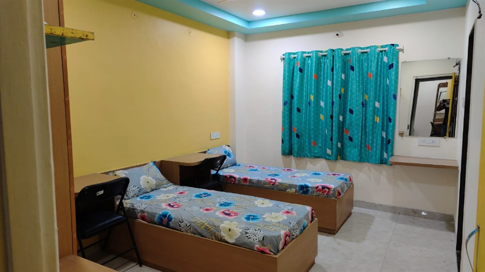 Trishakti Girls Residency Double Sharing 2 Bed Room with individual study desks and mirror